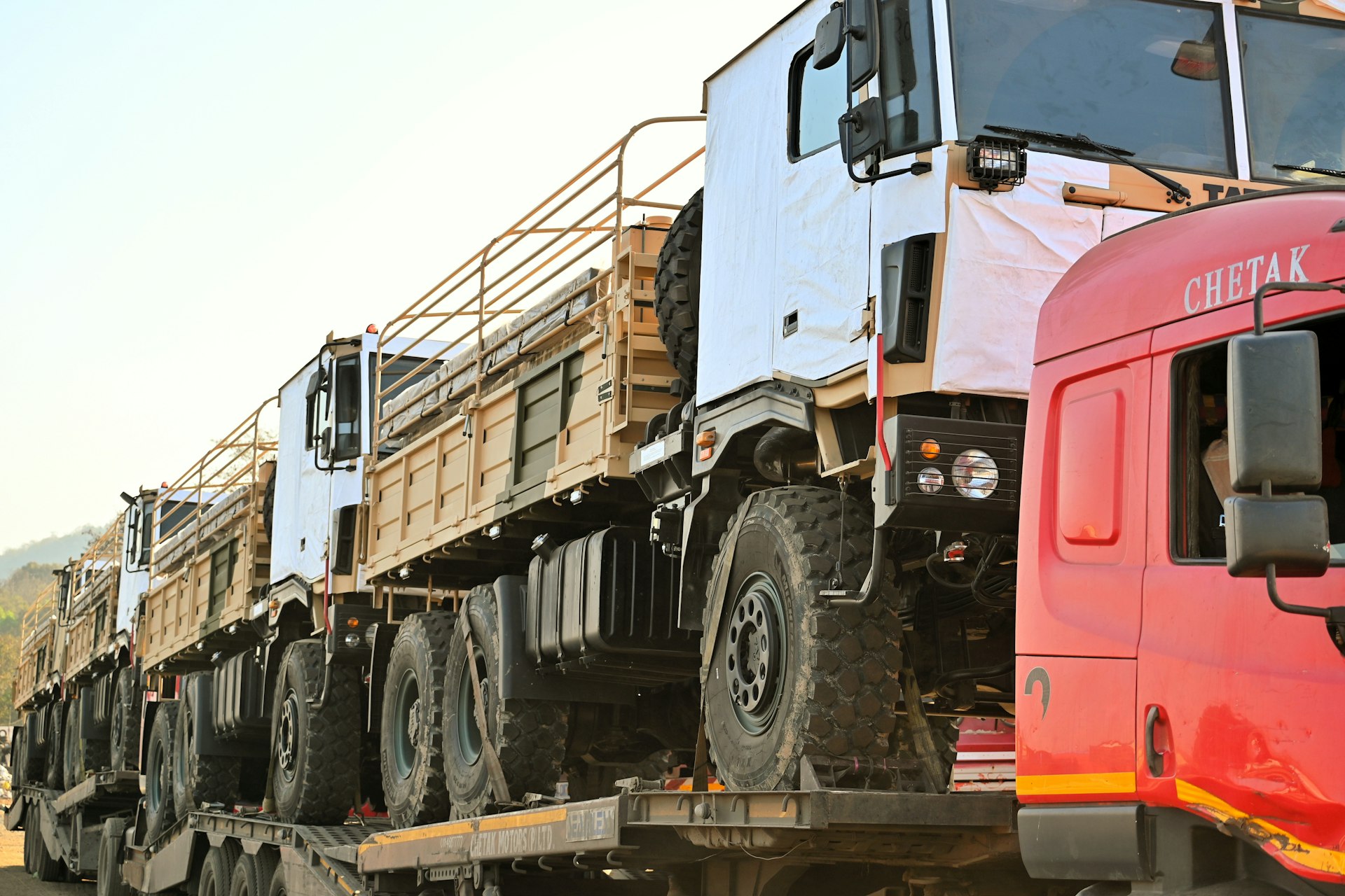 a row of trucks parked next to each other